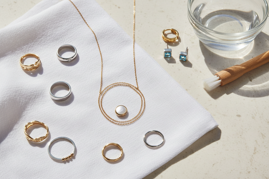 a collection of gold and silver rings, necklaces and earrings for cleaning